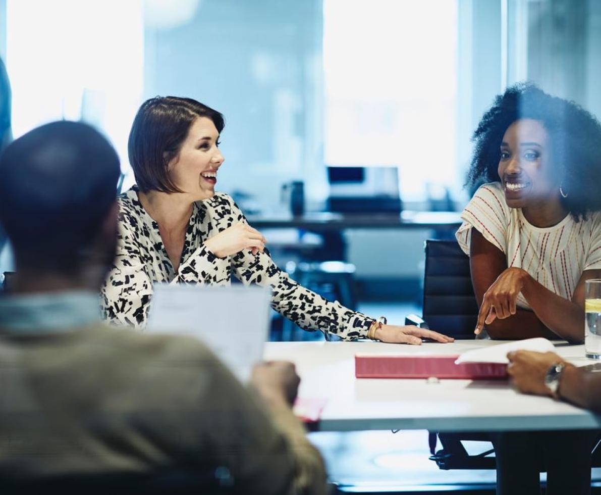 people sitting in a boardroom having a meeting